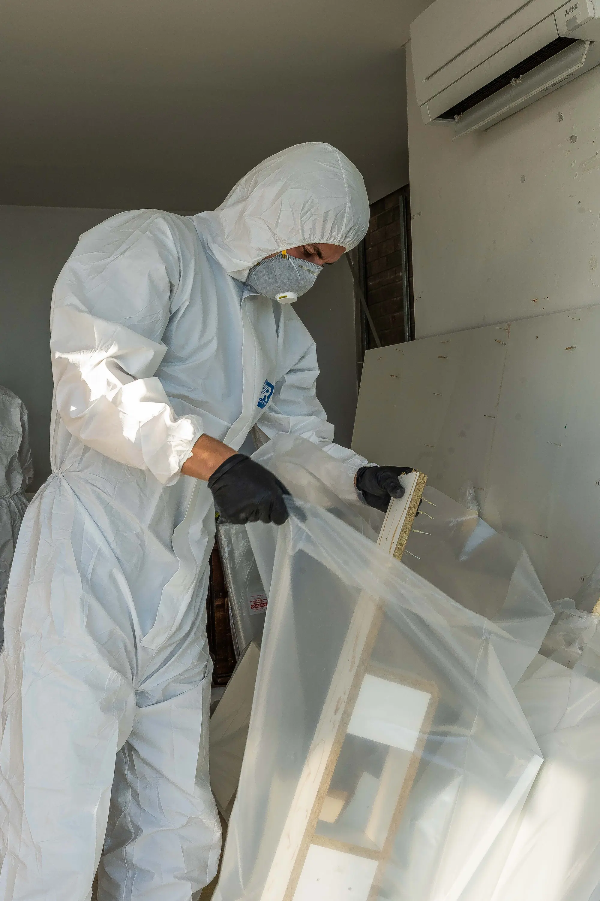 An affected panel wrapped and sealed ready for disposal